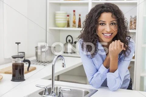 Young Woman Perfect Teeth and Smile in Kitchen Stock Photos