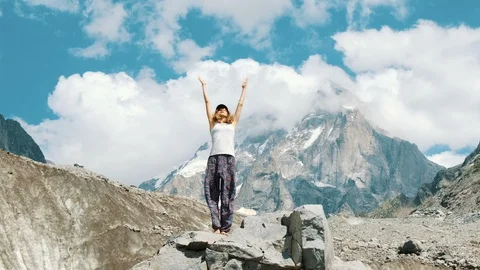 Young woman performs a basic warrior asana in yoga against the backdrop of a Video stock 95341797