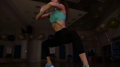 Young woman performs bodyflex exercise.Diagonal view.Glide cam footage. Stock Footage 111563694