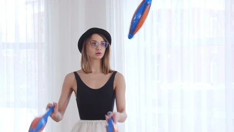 Young woman performs circus juggling Stock Footage 103588892