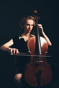 Young woman playing in a classical concert Stock Photos