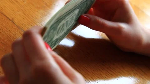 Young woman playing with stack of American paper Dollars Stock Footage 165054686