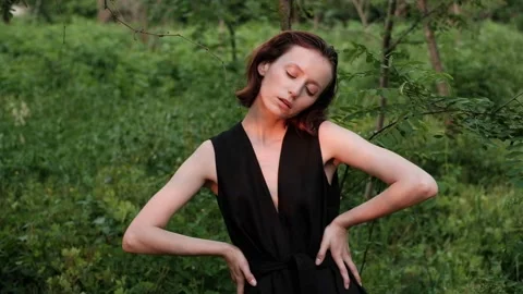 Young woman posing in the forest Stock Footage 140804012