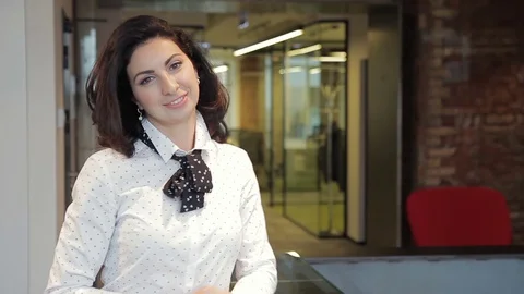Young woman posing while standing at reception of leading company. Stock Footage 83123351
