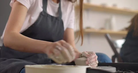 Young woman in pottery studio using pottery wheel, handmade ceramics, creative Stock Footage 155201739