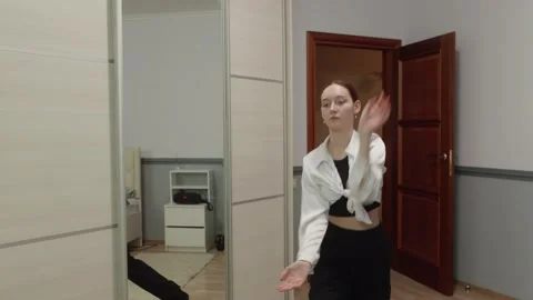Young woman practicing dance in front of mirror Stock Footage 310533865
