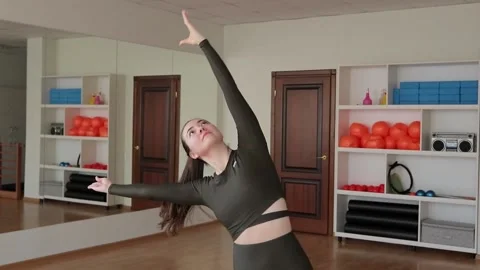 Young woman practicing pilates at studio Stock Footage 149784306