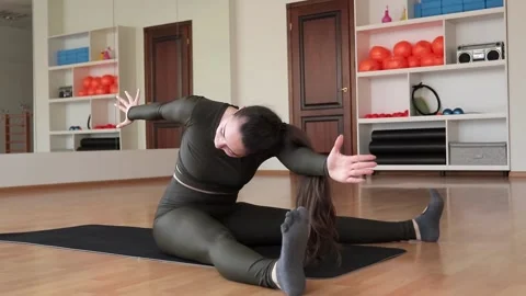 Young woman practicing pilates at studio Stock Footage 149784341