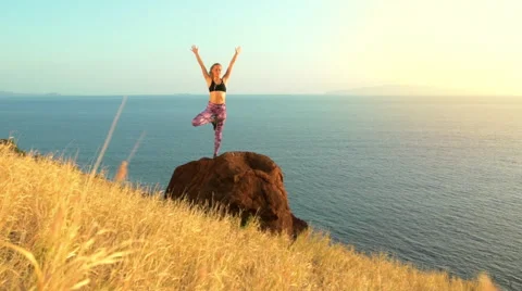 Young Woman Practicing Yoga in Nature. Reaching the Top. Mountian View at Sun Stock Footage 59031864