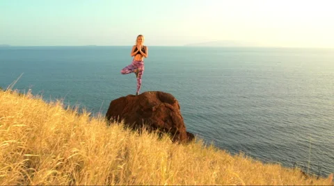 Young Woman Practicing Yoga in Nature. Reaching the Top. Mountian View at Sun Stock Footage 59032361