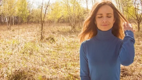 Young woman practicing yoga in a spring forest. Stock Footage