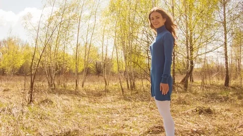 Young woman practicing yoga in a spring forest. Video stock 80614842