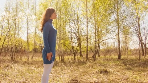 Young woman practicing yoga in a spring forest. 스톡 동영상 80614866