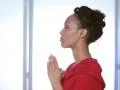 Young woman prays. 2 shots. Footage