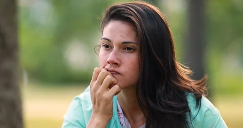 Young woman preoccupied with problem. Thoughtful girl thinking Stock Footage 126843541