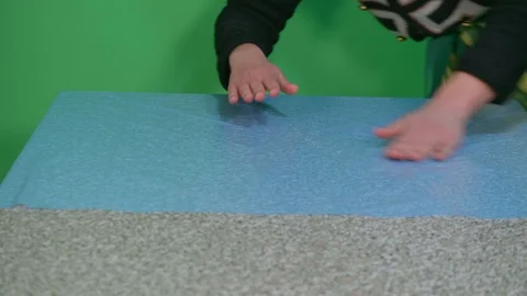 Young woman prepares objects for gardening at home - green screen background Stock Footage 126128200