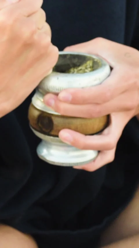 Young woman preparing customary argentinian beverage, Mate Stock Footage 269403241