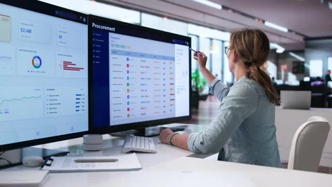 Young Woman In Procurement Department Using Software On Computer Stock Footage 342970656