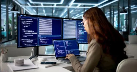 Young Woman Programmer Typing Code On Desktop, Developing New Web Application Stock Photos