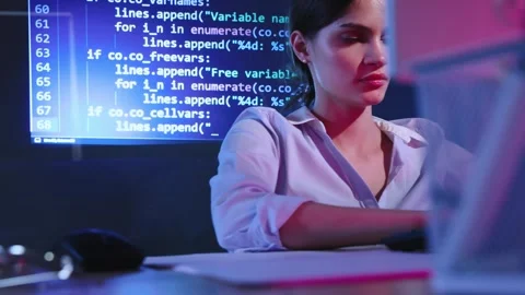 Young woman, programmer, web and app developer working on computer, writing Stock Footage 245346812