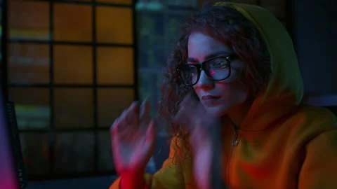 Young woman programming computer,putting on glasses. Stock Footage 218433882