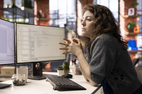 Young woman programming software code on her computer, Stock Photos