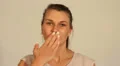 Young woman puckers up and blows a kiss at the camera HD Footage