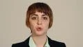 Young woman puckers lips and blows a kiss at the camera HD Footage
