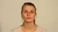 Young woman puckers lips and blows a kiss at the camera HD Footage