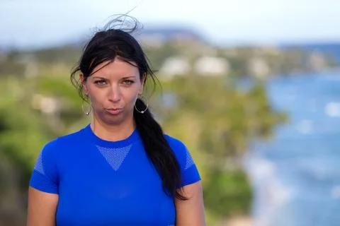 Young woman pulling faces pouting at the camera Stock Photos