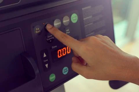 Young woman push Cardio function on treadmill in the gym.Concept fitness ,wor Foto stock