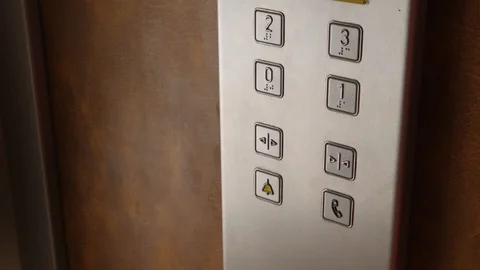 Young woman pushes elevator button and door closes. Pressing elevator button Stock Footage 106472687
