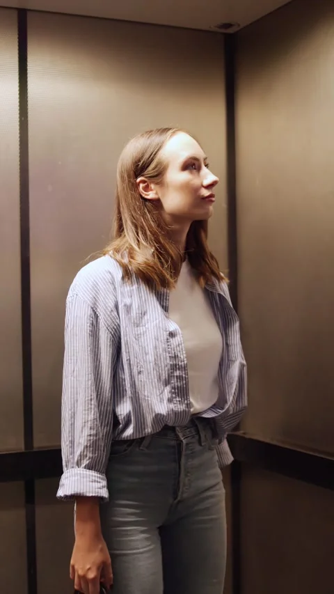 Young Woman Pushing Elevator Call Button, Waiting Stock Footage 314525251