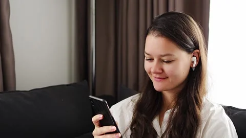 Young woman put on white modern Stock Video Pond5