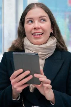 Young Woman Reading on E-Reader While Commuting on Subway Train.vertical Stock Photos