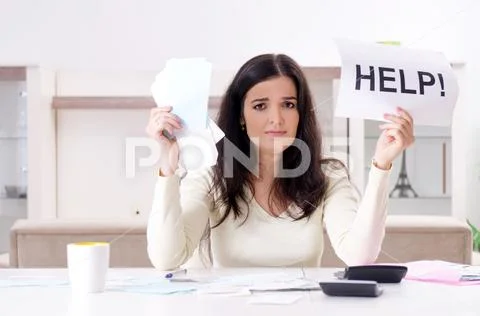 Young woman with receipts in budget planning concept Stock Photos