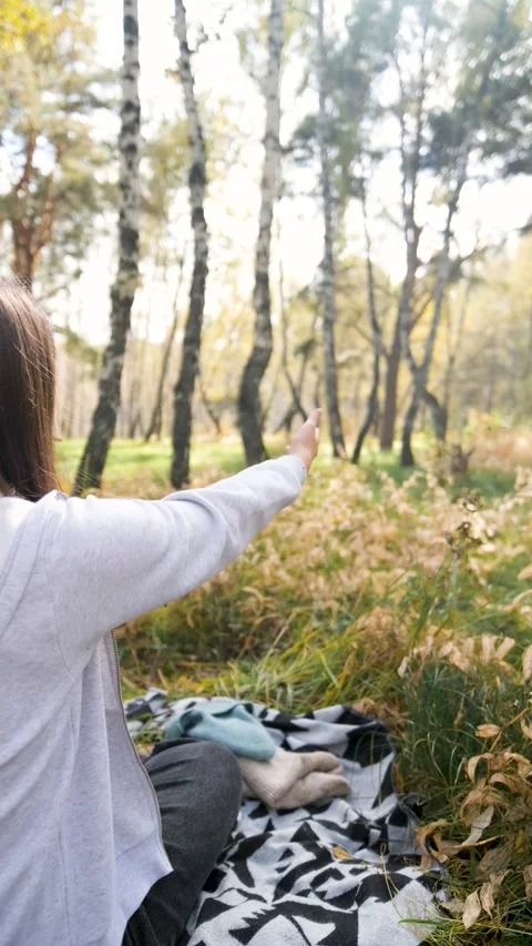 Young woman relaxes while walking her dog in autumn forest Stock-Footage 310520666