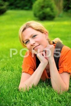 Young woman relaxing on the grass Stock Photos