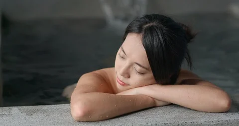 Young woman relaxing in japanese onsen Stock Footage