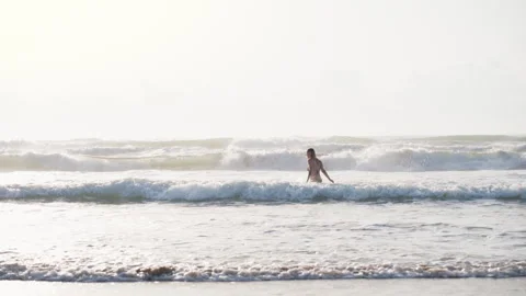 Young woman relaxing in the ocean while enjoying peaceful moments by the se.. Stock Footage 341598075