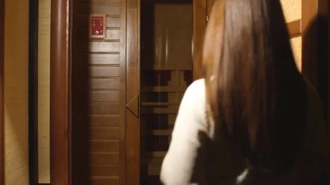 Young woman relaxing in a sauna. Gorgeou... | Stock Video | Pond5