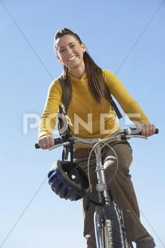 Young Woman Riding Mountain Bike Stock Photos