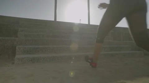 Young woman running on steps Stock Footage 63722056