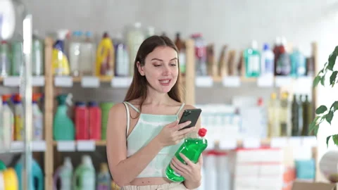 Young woman scanning qr code for dishwashing Stock Footage 314244712