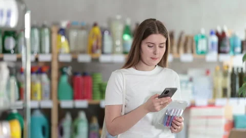 Young woman scanning qr code for razor Stock Footage 314762597