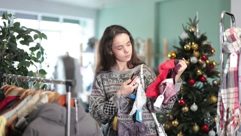 Young woman scanning qr code for lingerie in store Stock Footage 330044788
