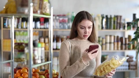 Young woman scanning qr code for chips 動画素材 341428896