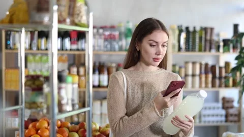 Young woman scanning qr code of soda Stock Footage 342129909