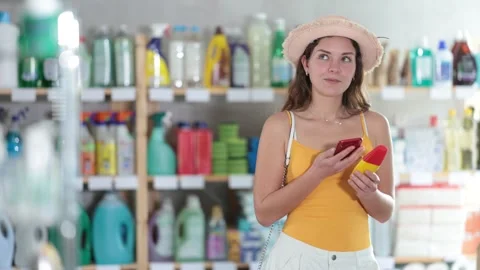 Young woman scanning qr code for repellent Vídeos de archivo 344774653