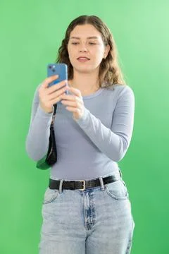 Young woman scans QR code or takes photo Foto stock
